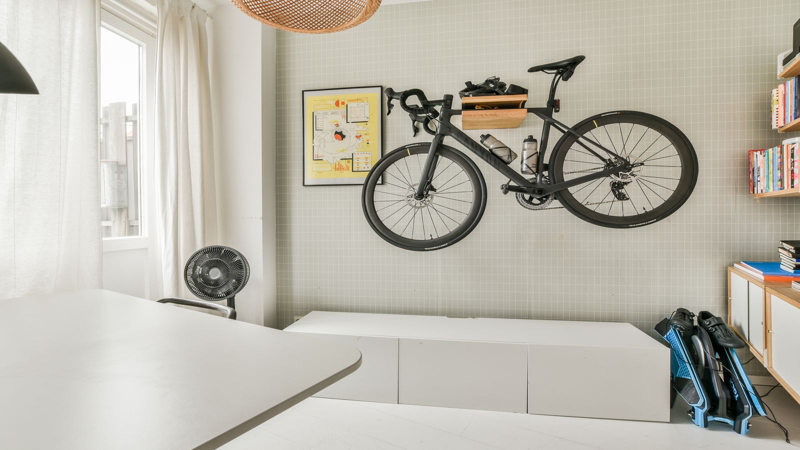 Well-designed home indoor cycling space with clean layout and proper ventilation